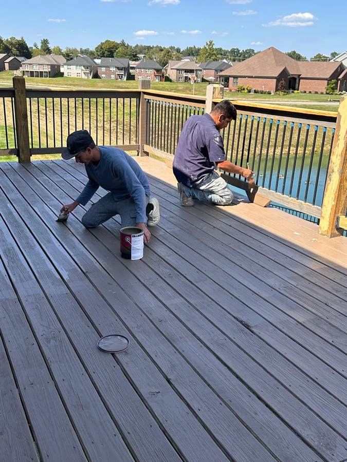 Daniel's Crew working on deck staining